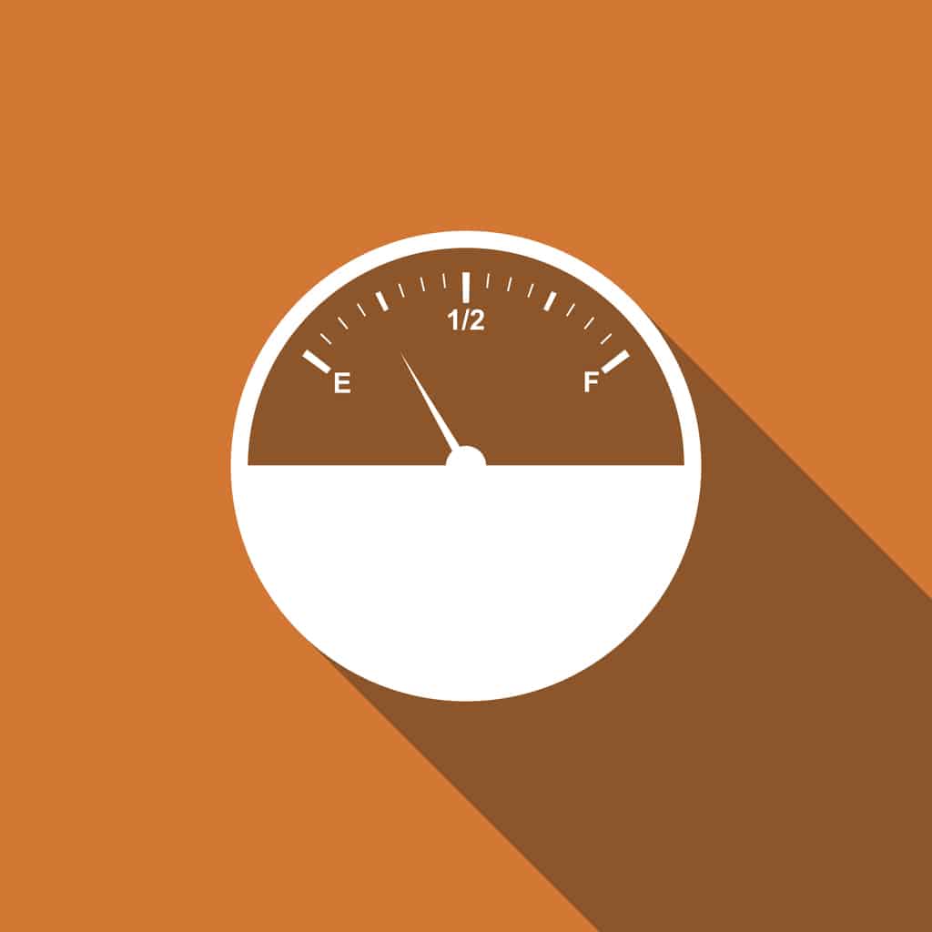 Fuel gauge showing half full, with indicators for empty (E) and full (F) on an orange background.